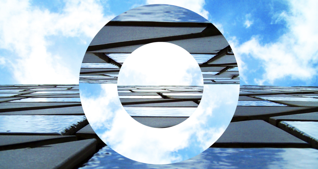 A photograph of an exterior wall of the Sydney Opera House. In the centre of the photograph, a donut shape has been cut out and flipped around to make a fun creative edit!