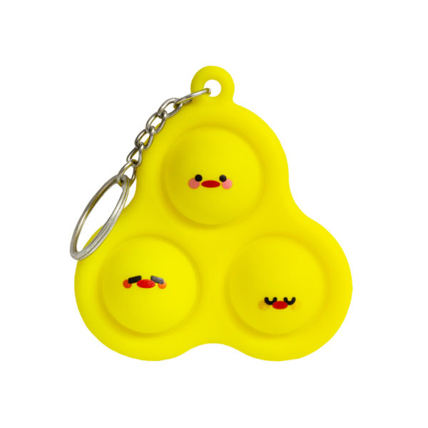 A photo of a yellow silicone Chicky Pop-It fidget toy. Features three adorable chicky faces!