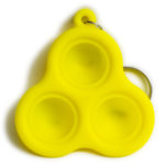 A photo of a yellow silicone Chicky Pop-It fidget toy, taken from the back. Features three adorable chicky faces!