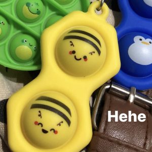 Photo of three Pop-It’s: a Buzzy Bee, a Froggy and a Penny.